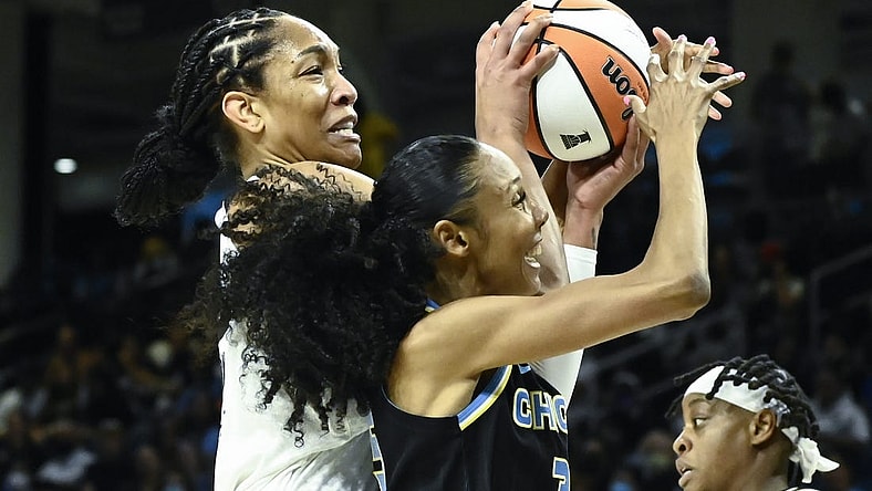 Jul 26, 2022; Chicago, IL, USA;  Las Vegas Aces forward A'ja Wilson (22), left, fights for the ball against Chicago Sky guard Rebekah Gardner (35) during the first half of the Commissioners Cup-Championships at Wintrust Arena. Mandatory Credit: Matt Marton-USA TODAY Sports