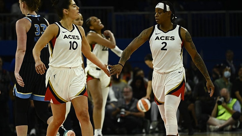 Jul 26, 2022; Chicago, IL, USA;  Las Vegas Aces guard Kelsey Plum (10) and Las Vegas Aces guard Riquna Williams (2) high five against the Chicago Sky during the second half of the Commissioners Cup-Championships at Wintrust Arena. Mandatory Credit: Matt Marton-USA TODAY Sports