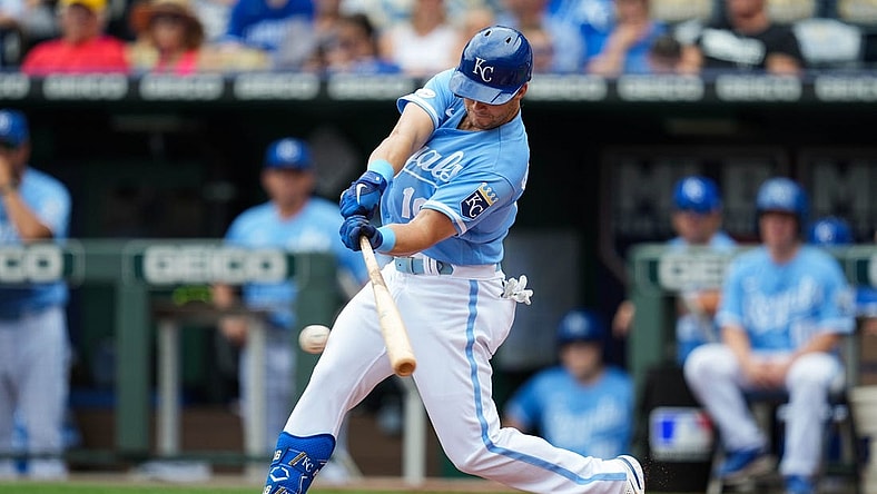 Jul 27, 2022; Kansas City, Missouri, USA; Kansas City Royals designated hitter Andrew Benintendi (16) hits a single against the Los Angeles Angels during the first inning at Kauffman Stadium. Mandatory Credit: Jay Biggerstaff-USA TODAY Sports