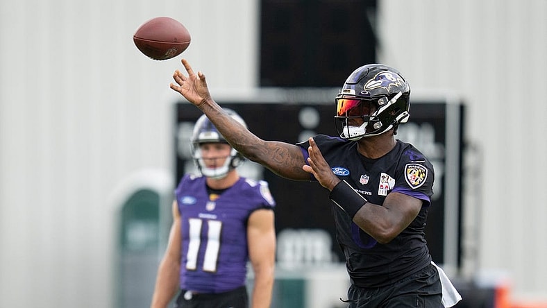 Jul 27, 2022; Owings Mills, MD, USA; Baltimore Ravens quarterback Lamar Jackson (8) throws the ball during day one of training camp at Under Armour Performance Center. Mandatory Credit: Jessica Rapfogel-USA TODAY Sports
