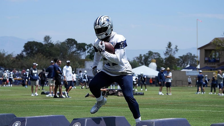 Jul 27, 2022; Oxnard, CA, USA; Dallas Cowboys running back Ezekiel Elliott (21) carries the ball during training camp at the River Ridge Fields. Mandatory Credit: Kirby Lee-USA TODAY Sports