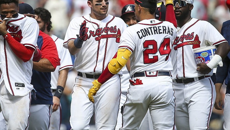 Jul 31, 2022; Atlanta, Georgia, USA; Atlanta Braves third baseman Austin Riley (27) celebrates with catcher William Contreras (24) after a game-winning RBI double against the Arizona Diamondbacks at Truist Park. Mandatory Credit: Brett Davis-USA TODAY Sports