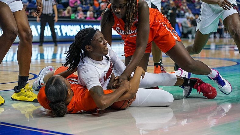 Mar 6, 2020; Greensboro, NC, UCA; Louisville Cardinals guard Jazmine Jones (23) tries to maintain possession against the Syracuse Orange during the first half at Greensboro Coliseum. Mandatory Credit: Jim Dedmon-USA TODAY Sports
