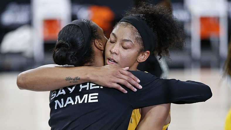 Sep 17, 2020; Palmetto, Florida, USA;  Los Angeles Sparks forward Candace Parker (3) and Connecticut Sun forward DeWanna Bonner (24) hug after the game at the FELD entertainment complex. Mandatory Credit: Reinhold Matay-USA TODAY Sports