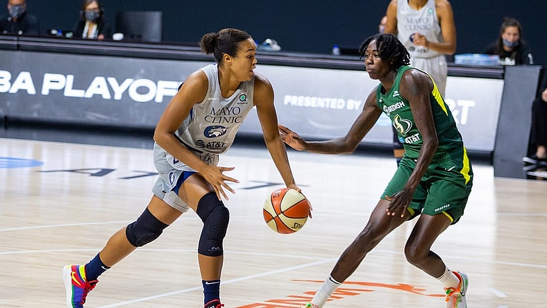 Sep 24, 2020; Bradenton, Florida, USA; Minnesota Lynx forward Napheesa Collier (24) drives past Seattle Storm forward Natasha Howard (6) during Game 2 of the WNBA Semifinals at Feld Entertainment. Mandatory Credit: Mary Holt-USA TODAY Sports