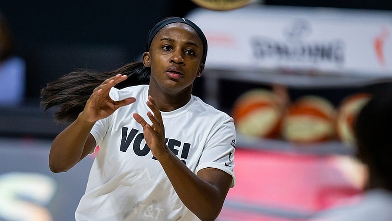 Sep 29, 2020; Bradenton, Florida, USA; Las Vegas Aces guard Jackie Young (0) warms up in a "Vote!" shirt before game 5 of the WNBA semifinals between the Connecticut Suns and the Las Vegas Aces at IMG Academy. Mandatory Credit: Mary Holt-USA TODAY Sports