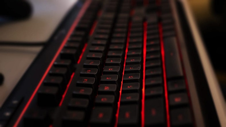 A custom gaming keyboard backlit with red LED lights waits for tactile input before Manual took on Boone County in a Rocket League match, which was streamed on YouTube on Thursday, March 5, 2020.