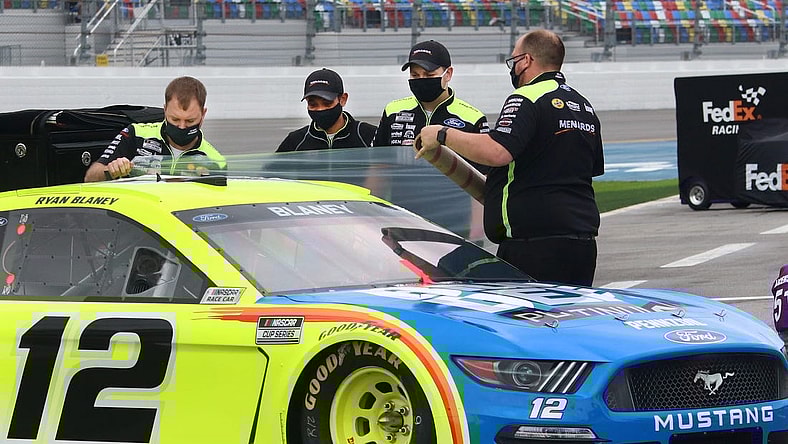 Crewmen seal up Ryan Blaney's Ford with clingy plastic wrap before putting the car cover on, Sunday morning February 14, 2021 as rain treatens the Daytona 500.
Dtb Daytona 500 1
