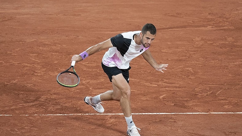 Jun 4, 2021; Paris, France;  Laslo Djere (SRB) in action during his match against Alexander Zverev (GER) on day six of the French Open at Stade Roland Garros. Mandatory Credit: Susan Mullane-USA TODAY Sports
