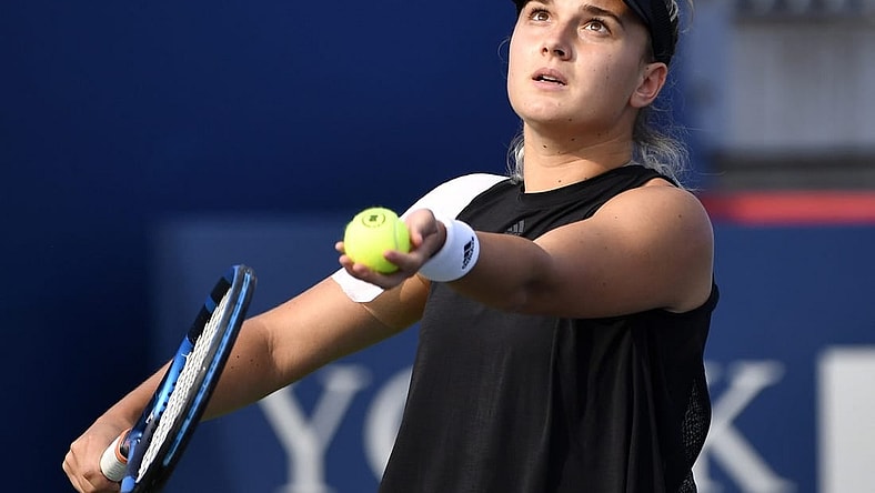 Aug 9, 2021; Montreal, Quebec, Canada; Clara Burel of France serves against Ons Jabeur of Tunisia (not pictured) during first round play at Stade IGA. Mandatory Credit: Eric Bolte-USA TODAY Sports