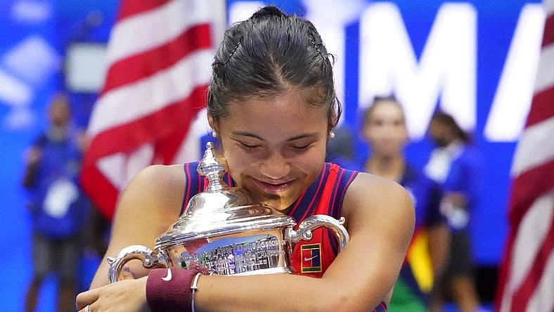 Sep 11, 2021; Flushing, NY, USA; Emma Raducanu of Great Britain celebrates with the championship trophy after her match against Leylah Fernandez of Canada (not pictured) in the women's singles final on day thirteen of the 2021 U.S. Open tennis tournament at USTA Billie Jean King National Tennis Center. Mandatory Credit: Robert Deutsch-USA TODAY Sports
