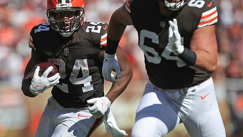Cleveland Browns running back Nick Chubb (24) rushes for yards behind Cleveland Browns center JC Tretter (64) during the second half of an NFL football game against the Houston Texans, Sunday, Sept. 19, 2021, in Cleveland, Ohio.

Chubb 1