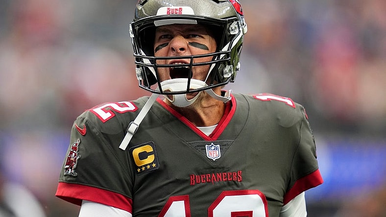 Sep 26, 2021; Inglewood, California, USA; Tampa Bay Buccaneers quarterback Tom Brady (12) yells at Bucs fans as he takes the field for pregame warmups before playing the Los Angeles Rams. Mandatory Credit: Robert Hanashiro-USA TODAY Sports