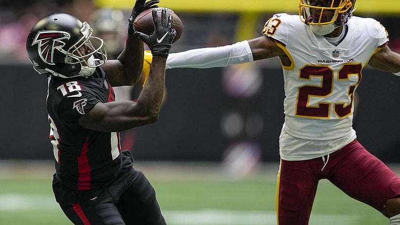 Oct 3, 2021; Atlanta, Georgia, USA; Atlanta Falcons wide receiver Calvin Ridley (18) tries to catch a pass behind Washington Football Team cornerback William Jackson III (23) during the second half at Mercedes-Benz Stadium. Mandatory Credit: Dale Zanine-USA TODAY Sports