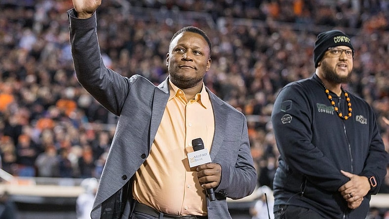 Nov 13, 2021; Stillwater, Oklahoma, USA;  Barry Sanders acknowledges the Oklahoma State Cowboys crowd before the game against the TCU Horned Frogs at Boone Pickens Stadium. OSU won 63-17. Mandatory Credit: Brett Rojo-USA TODAY Sports
