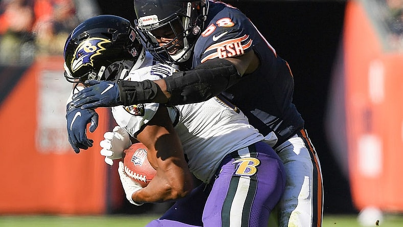 Nov 21, 2021; Chicago, Illinois, USA; Chicago Bears inside linebacker Roquan Smith (58) tackles Baltimore Ravens wide receiver Devin Duvernay (13) in the first half at Soldier Field. Mandatory Credit: Quinn Harris-USA TODAY Sports