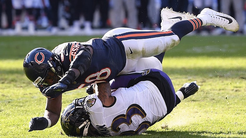Nov 21, 2021; Chicago, Illinois, USA; Chicago Bears inside linebacker Roquan Smith (58) tackles Baltimore Ravens running back Devonta Freeman (33) in the second half at Soldier Field. Mandatory Credit: Quinn Harris-USA TODAY Sports