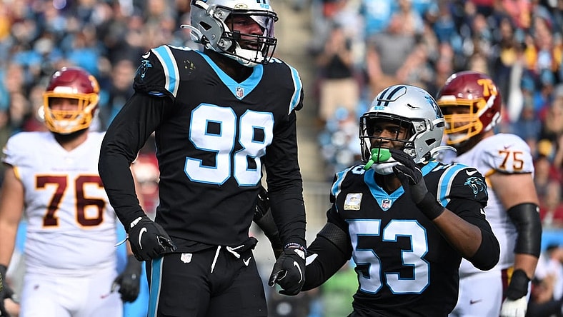 Nov 21, 2021; Charlotte, North Carolina, USA; Carolina Panthers defensive end Marquis Haynes (98) reacts with defensive end Brian Burns (53) after sacking Washington Football Team quarterback Taylor Heinicke (4) (not pictured) in the second quarter at Bank of America Stadium. Mandatory Credit: Bob Donnan-USA TODAY Sports
