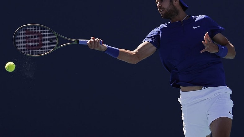 Mar 26, 2022; Miami Gardens, FL, USA; Karen Khachanov  hits a forehand against Tommy Paul (USA) (not pictured) in a second round men's singles match in the Miami Open at Hard Rock Stadium. Mandatory Credit: Geoff Burke-USA TODAY Sports