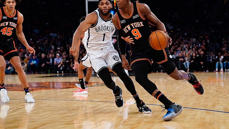 Apr 6, 2022; New York, New York, USA; New York Knicks shooting guard RJ Barrett (9) dribbles the ball against Brooklyn Nets small forward Bruce Brown (1) during the second half at Madison Square Garden. Mandatory Credit: Gregory Fisher-USA TODAY Sports