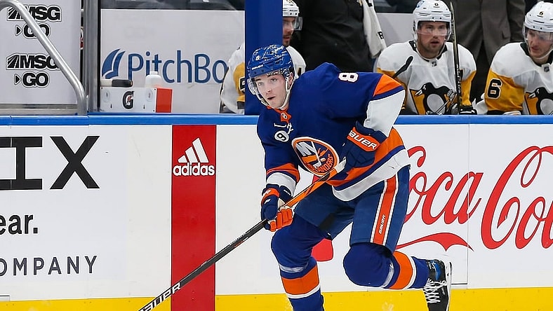 Apr 12, 2022; Elmont, New York, USA; New York Islanders defenseman Noah Dobson (8) skates with the puck against the Pittsburgh Penguins during the second period at UBS Arena. Mandatory Credit: Tom Horak-USA TODAY Sports