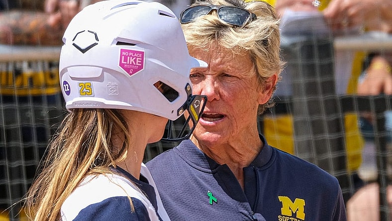 With players in scoring position, Michigan Head Softball Coach Carol Hutchins talks with Audrey LeClair (25) before she bats in the Big Ten Softball Championship Game at Secchia Stadium Saturday, May 14, 2022.

Nebraska Uofm Softball 11