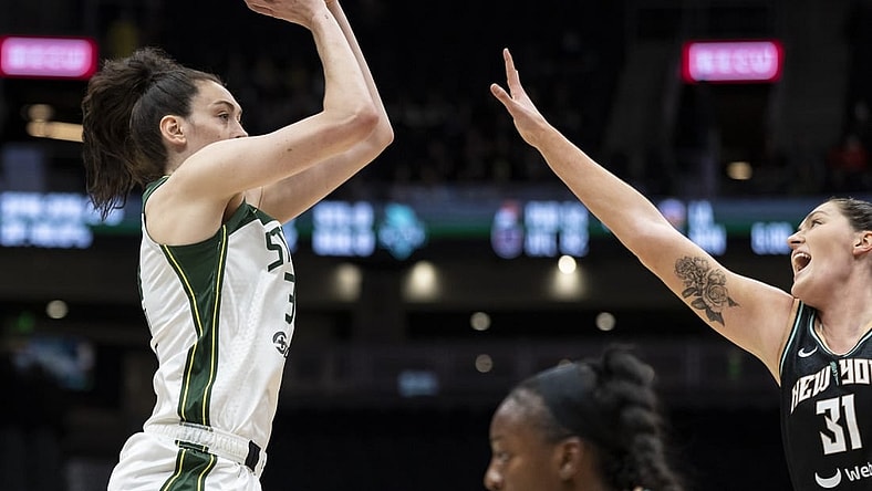 May 29, 2022; Seattle, Washington, USA; Seattle Storm forward Breanna Stewart (30) shoots the ball over New York Liberty center Stefanie Dolson (31) during the first half at Climate Pledge Arena. Mandatory Credit: Stephen Brashear-USA TODAY Sports