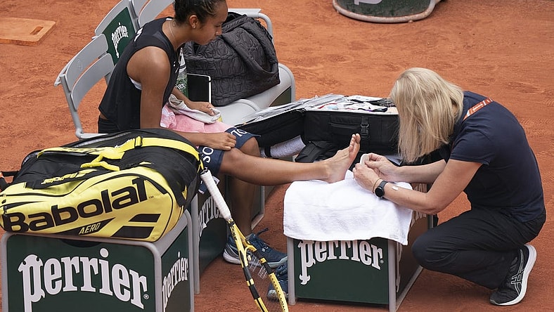 May 31, 2022; Paris, France; Leylah Fernandez (CAN) receives treatment on her foot during her match against Martina Trevisan (ITA)  on day 10 of the French Open at Stade Roland-Garros. Mandatory Credit: Susan Mullane-USA TODAY Sports