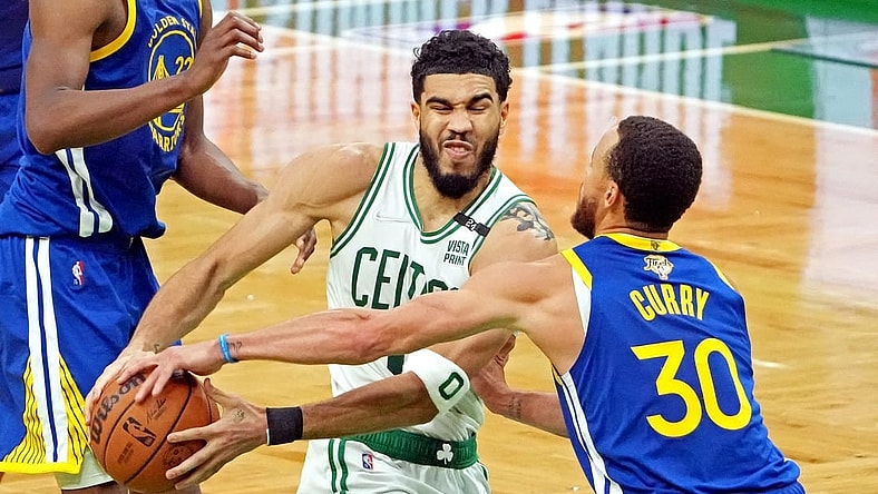Jun 16, 2022; Boston, Massachusetts, USA; Boston Celtics forward Jayson Tatum (0) drives to the basket against Golden State Warriors guard Stephen Curry (30) during the third quarter in game six of the 2022 NBA Finals at TD Garden. Mandatory Credit: Kyle Terada-USA TODAY Sports