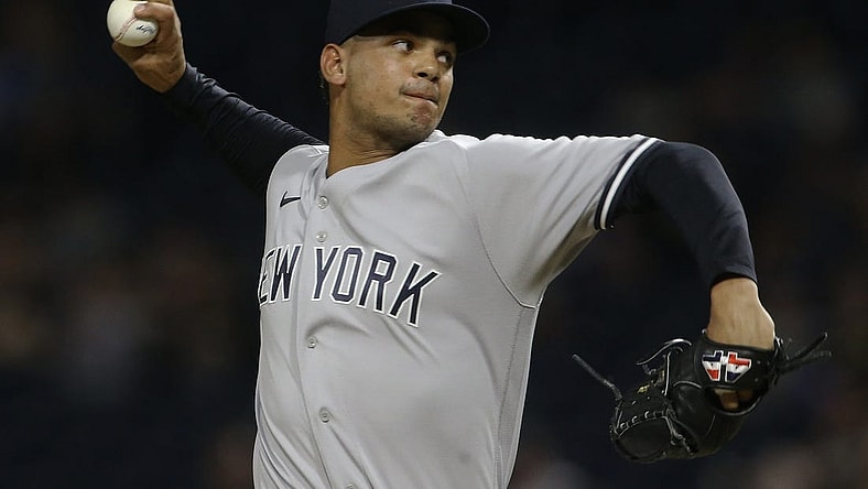 Jul 6, 2022; Pittsburgh, Pennsylvania, USA; New York Yankees relief pitcher Albert Abreu (84) throws a pitch against the Pittsburgh Pirates during the ninth inning at PNC Park. Mandatory Credit: Charles LeClaire-USA TODAY Sports