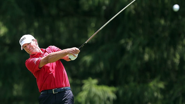 Steve Stricker watches his ball down the fairway on the 13th hole during third round of the Bridgestone Senior Players Championship at Firestone Country Club on Saturday.

Bridgestone 8