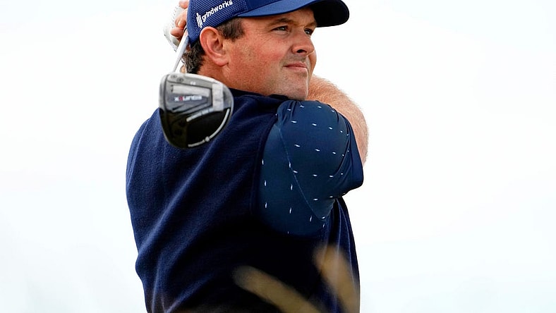 Jul 14, 2022; St. Andrews, SCT; Patrick Reed tees off on the sixth hole during the first round of the 150th Open Championship golf tournament at St. Andrews Old Course. Mandatory Credit: Rob Schumacher-USA TODAY Sports