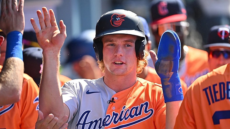 Jul 16, 2022; Los Angeles, CA, USA; American League Futures third baseman Gunnar Henderson (2) is greeted in the dugout after scoring a run in the first inning of the All Star-Futures Game at Dodger Stadium. Mandatory Credit: Jayne Kamin-Oncea-USA TODAY Sports