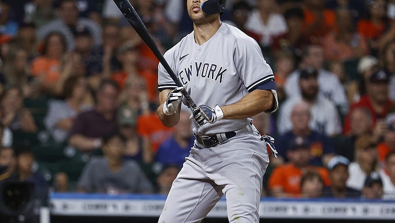 Jul 21, 2022; Houston, Texas, USA; New York Yankees left fielder Giancarlo Stanton (27) reacts after striking out during the eighth inning against the Houston Astros at Minute Maid Park. Mandatory Credit: Troy Taormina-USA TODAY Sports