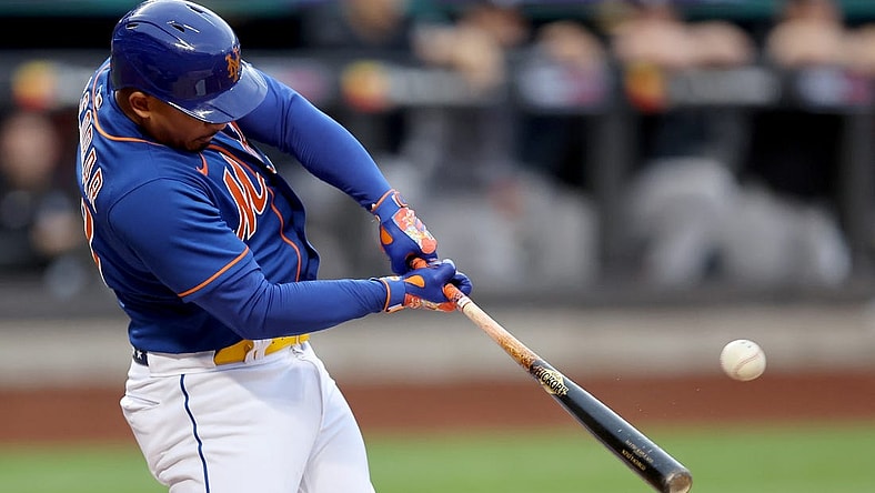 Jul 26, 2022; New York City, New York, USA; New York Mets third baseman Eduardo Escobar (10) hits a two run home run against the New York Yankees during the first inning at Citi Field. Mandatory Credit: Brad Penner-USA TODAY Sports