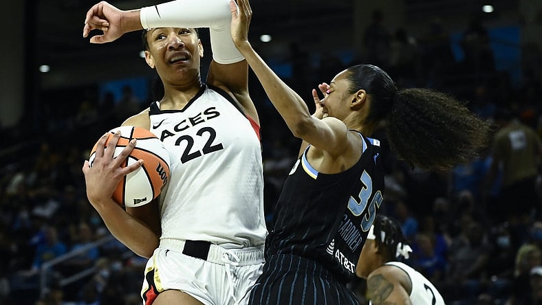 Jul 26, 2022; Chicago, IL, USA;  Las Vegas Aces forward A'ja Wilson (22), left, fights for the ball against Chicago Sky guard Rebekah Gardner (35) during the first half of the Commissioners Cup-Championships at Wintrust Arena. Mandatory Credit: Matt Marton-USA TODAY Sports