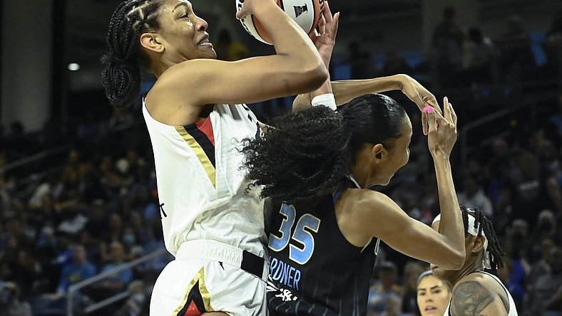 Jul 26, 2022; Chicago, IL, USA;  Las Vegas Aces forward A'ja Wilson (22), left, fights for the ball against Chicago Sky guard Rebekah Gardner (35) during the first half of the Commissioners Cup-Championships at Wintrust Arena. Mandatory Credit: Matt Marton-USA TODAY Sports