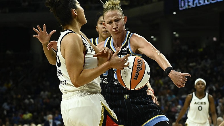 Jul 26, 2022; Chicago, IL, USA;  Chicago Sky forward Candace Parker (3), back and Chicago Sky guard Courtney Vandersloot (22) fight for the ball against Las Vegas Aces guard Kelsey Plum (10) during the second half of the Commissioners Cup-Championships at Wintrust Arena. Mandatory Credit: Matt Marton-USA TODAY Sports