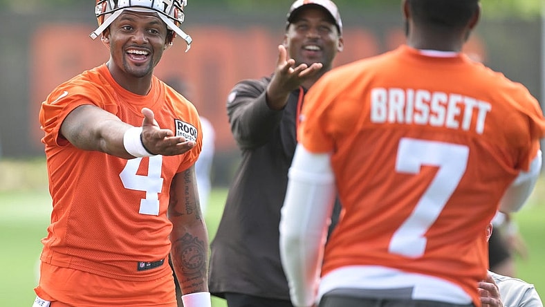 Jul 29, 2022; Berea, OH, USA; Cleveland Browns quarterback Deshaun Watson (4) talks to quarterback Jacoby Brissett (7) during training camp at CrossCountry Mortgage Campus. Mandatory Credit: Ken Blaze-USA TODAY Sports
