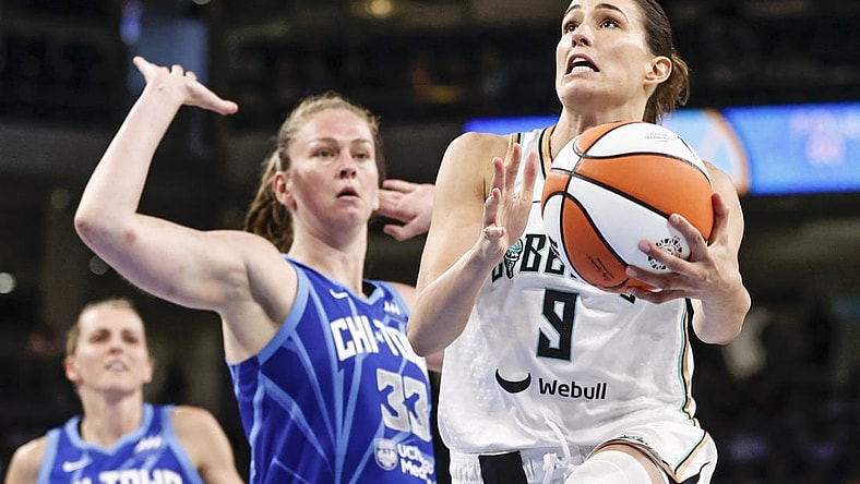Jul 29, 2022; Chicago, Illinois, USA; New York Liberty guard Rebecca Allen (9) goes to the basket against Chicago Sky forward Emma Meesseman (33) during the second half of the WNBA game at Wintrust Arena. Mandatory Credit: Kamil Krzaczynski-USA TODAY Sports