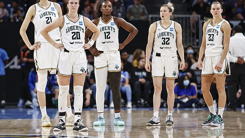 Jul 29, 2022; Chicago, Illinois, USA; New York Liberty center Han Xu (21), guard Sabrina Ionescu (20), forward Michaela Onyenwere (12), guard Sami Whitcomb (32) and guard Marine Johannes (23) stand on the court during the second half of the WNBA game against the Chicago Sky at Wintrust Arena. Mandatory Credit: Kamil Krzaczynski-USA TODAY Sports