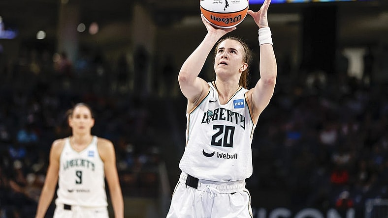 Jul 29, 2022; Chicago, Illinois, USA; New York Liberty guard Sabrina Ionescu (20) shoots a free throw against the Chicago Sky during the second half of the WNBA game at Wintrust Arena. Mandatory Credit: Kamil Krzaczynski-USA TODAY Sports