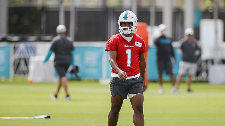 Aug 1, 2022; Miami Gardens, Florida, US; Miami Dolphins quarterback Tua Tagovailoa (1) watches from the field during training camp at Baptist Health Training Complex. Mandatory Credit: Sam Navarro-USA TODAY Sports