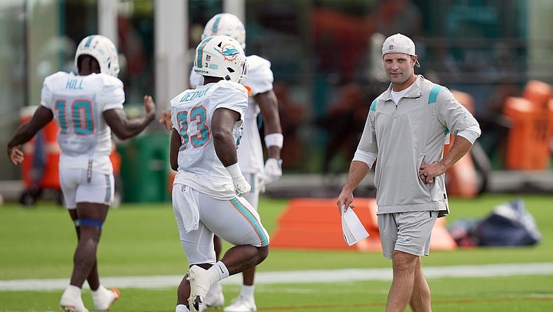 Aug 5, 2022; Miami Gardens, Florida, US; Miami Dolphins wide receivers coach Wes Welker walks on the field during training camp at Baptist Health Training Complex. Mandatory Credit: Jasen Vinlove-USA TODAY Sports