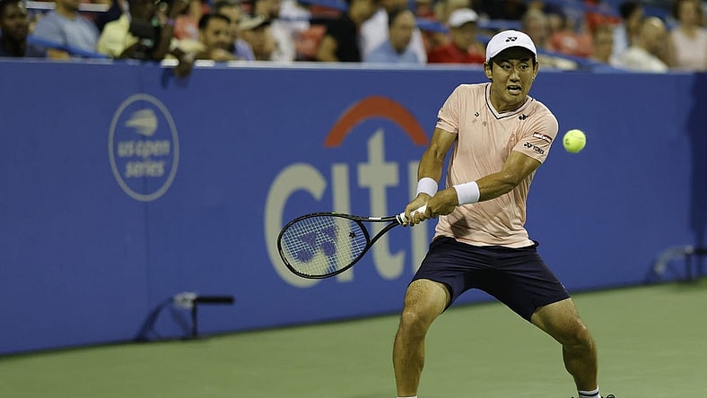 Aug 6, 2022; Washington, DC, USA; Yoshihito Nishioka (JPN) hits a backhand against Andrey Rublev (not pictured) in a men's single's semifinal on day six of the Citi Open at Rock Creek Park Tennis Center. Mandatory Credit: Geoff Burke-USA TODAY Sports