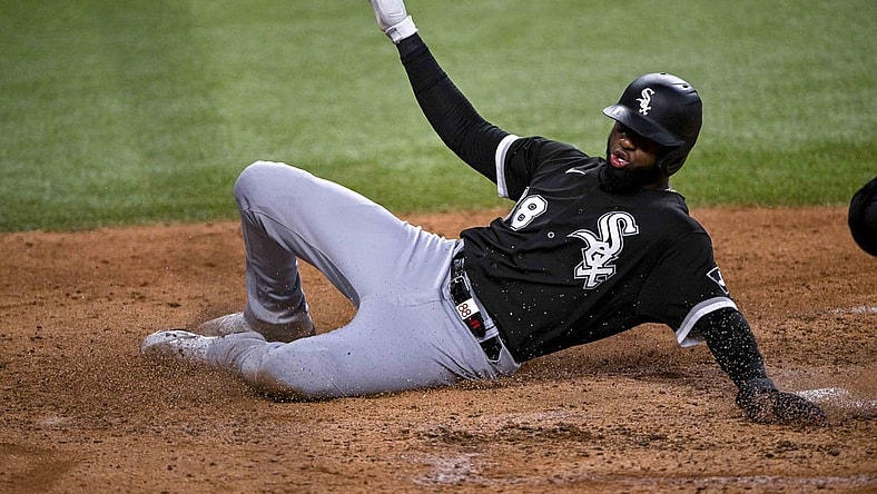 Aug 7, 2022; Arlington, Texas, USA; Chicago White Sox center fielder Luis Robert (88) scores against the Texas Rangers during the fourth inning at Globe Life Field. Mandatory Credit: Jerome Miron-USA TODAY Sports