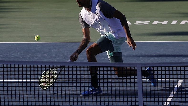 Aug 7, 2022; Washington, DC, USA; Nick Kyrgios (AUS) hits a volley against Yoshihito Nishioka (JPN) (not pictured) in the men's singles final on day seven of the Citi Open at Rock Creek Park Tennis Center. Mandatory Credit: Geoff Burke-USA TODAY Sports