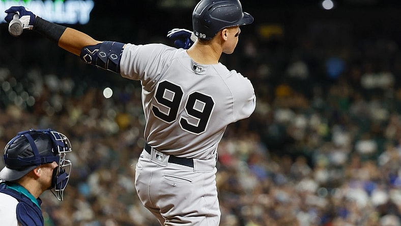 Aug 8, 2022; Seattle, Washington, USA; New York Yankees right fielder Aaron Judge (99) hits a solo-home run against the Seattle Mariners during the ninth inning at T-Mobile Park. Mandatory Credit: Joe Nicholson-USA TODAY Sports