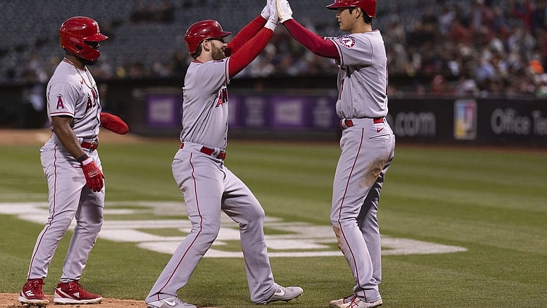 Aug 9, 2022; Oakland, California, USA;  Los Angeles Angels starting pitcher Shohei Ohtani (17) celebrates with Los Angeles Angels right fielder Taylor Ward (3) after hitting a three run homerun during the fifth inning against the Oakland Athletics at RingCentral Coliseum. Mandatory Credit: Stan Szeto-USA TODAY Sports
