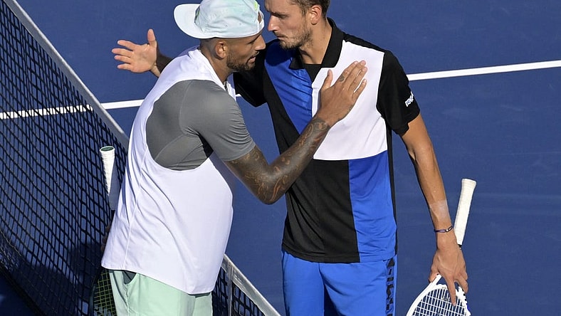Aug 10, 2022; Montreal, QC, Canada; Nick Kyrgios (AUS) (left) and Daniil Medvedev hug in second round play at IGA Stadium. Mandatory Credit: Eric Bolte-USA TODAY Sports